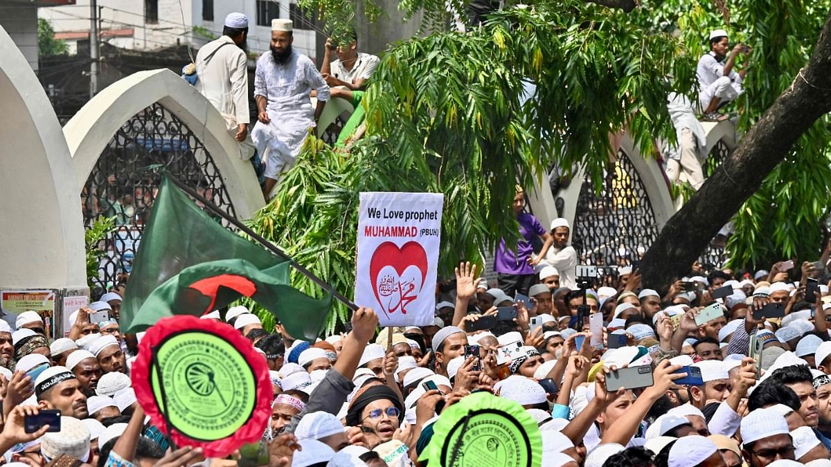 Bangladesh's Islamist parties' activists and supporters hold placards as they shout anti-India slogans during a demonstration in Dhaka. Credit: AFP Photo