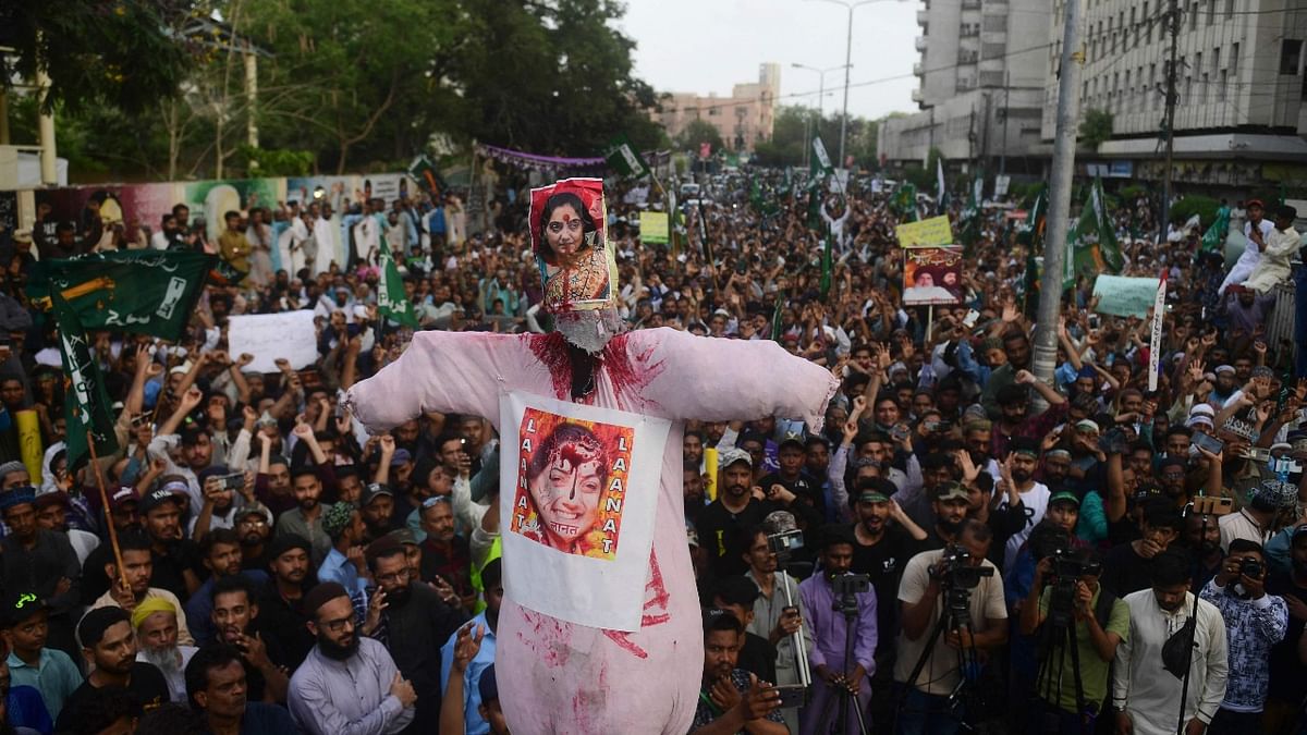 Demonstrators carry an effigy of Sharma during a protest in Karachi on June 10, 2022. Credit: AFP Photo