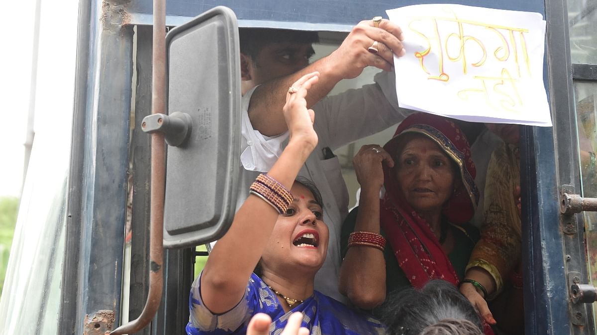 Congress activists were detained during a protest against the summoning of the party's president Sonia Gandhi and party leader Rahul Gandhi in the National Herald case in New Delhi. Credit: PTI Photo