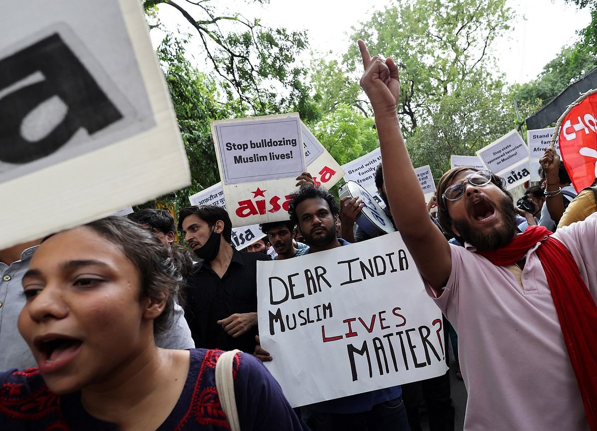 Members and supporters of AISA shout slogans during a protest against what they say are attacks on Muslims following clashes last week triggered by remarks made by ruling BJP figures on Prophet Mohammad. Credit: Reuters Photo