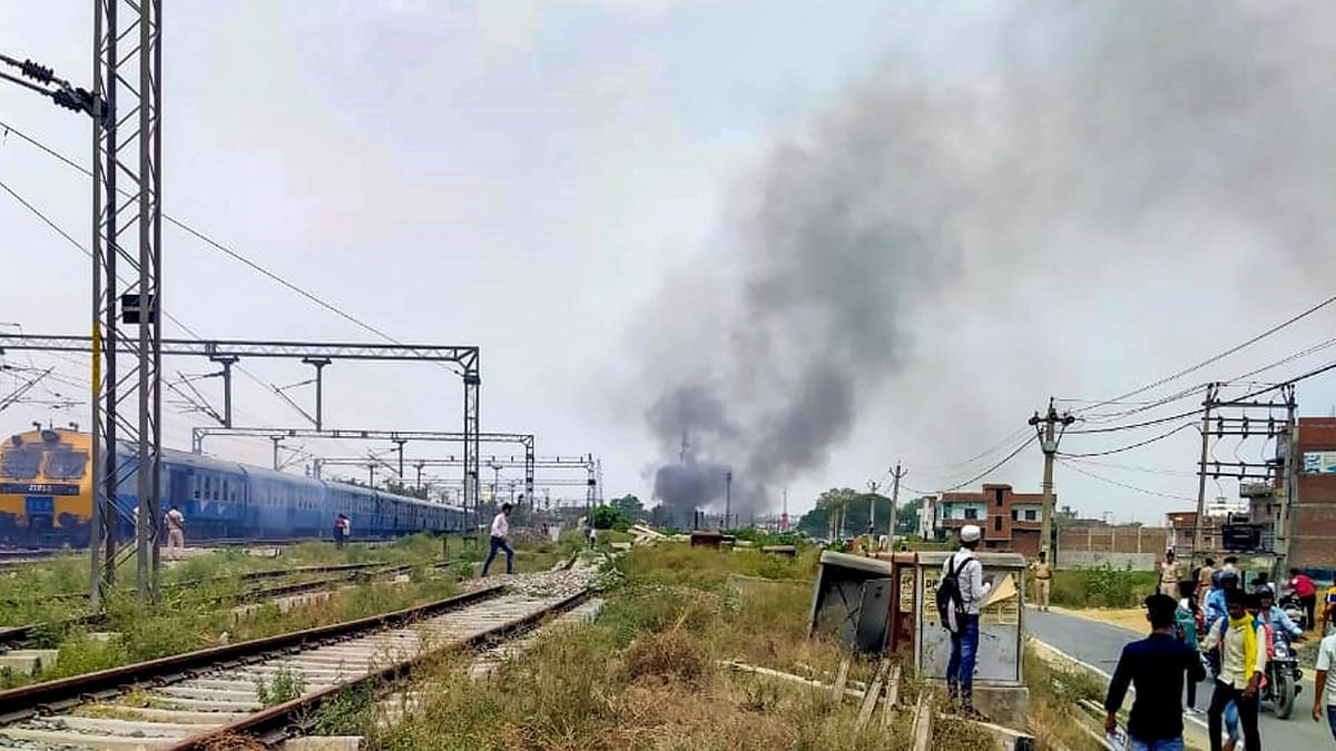 In Kaimur, they set Inter-city Express train on fire. Credit: PTI Photo
