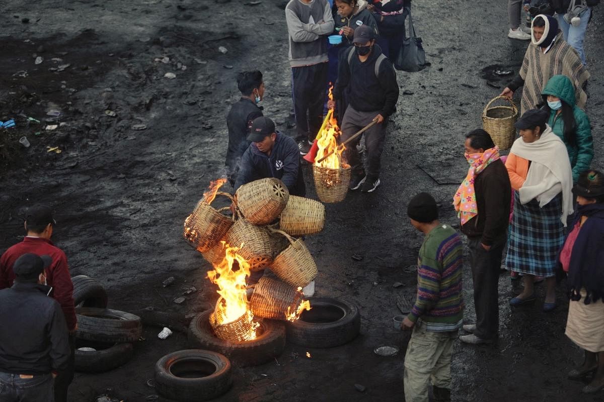 Indigenous protesters demanding cheaper fuel in Ecuador defied a state of emergency, pressing on with road blockages now in their sixth day. Credit: AFP Photo