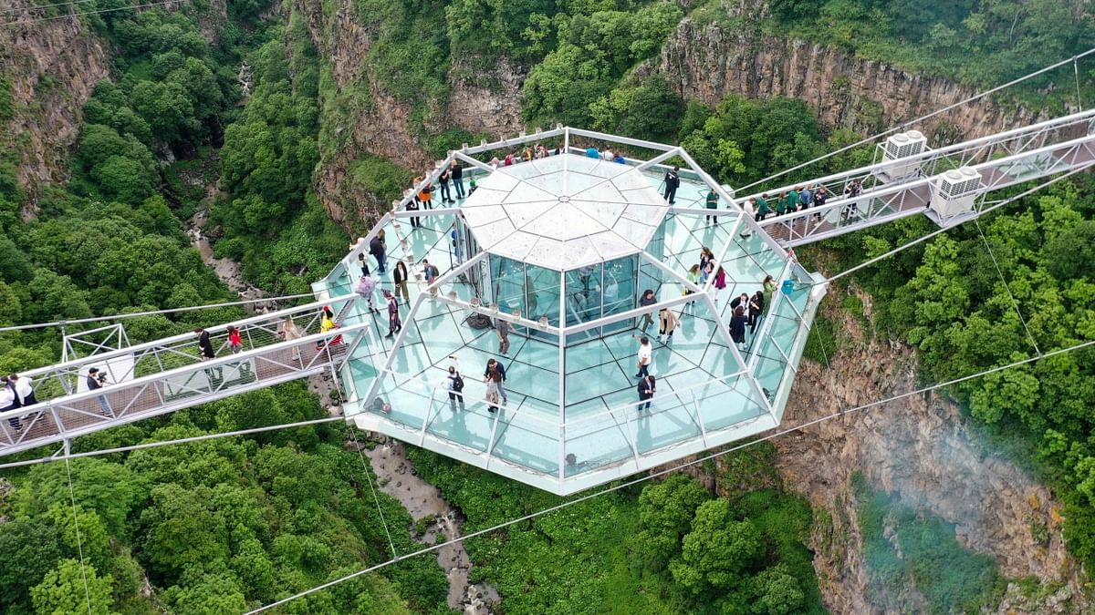 People attending the opening ceremony of the 240-meter long glass bridge over the Tsalka canyon, outside the city of Tsalka, some 100 km from Tbilisi. Credit: AFP Photo