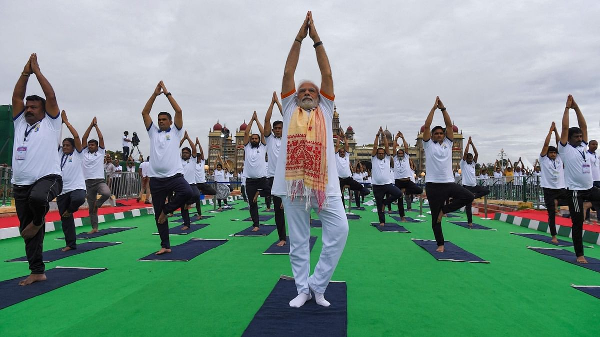Prime Minister Narendra Modi kicked off the Yoga celebrations in the backdrop of the iconic Mysuru Palace on June 21, 2022. Credit: AFP Photo