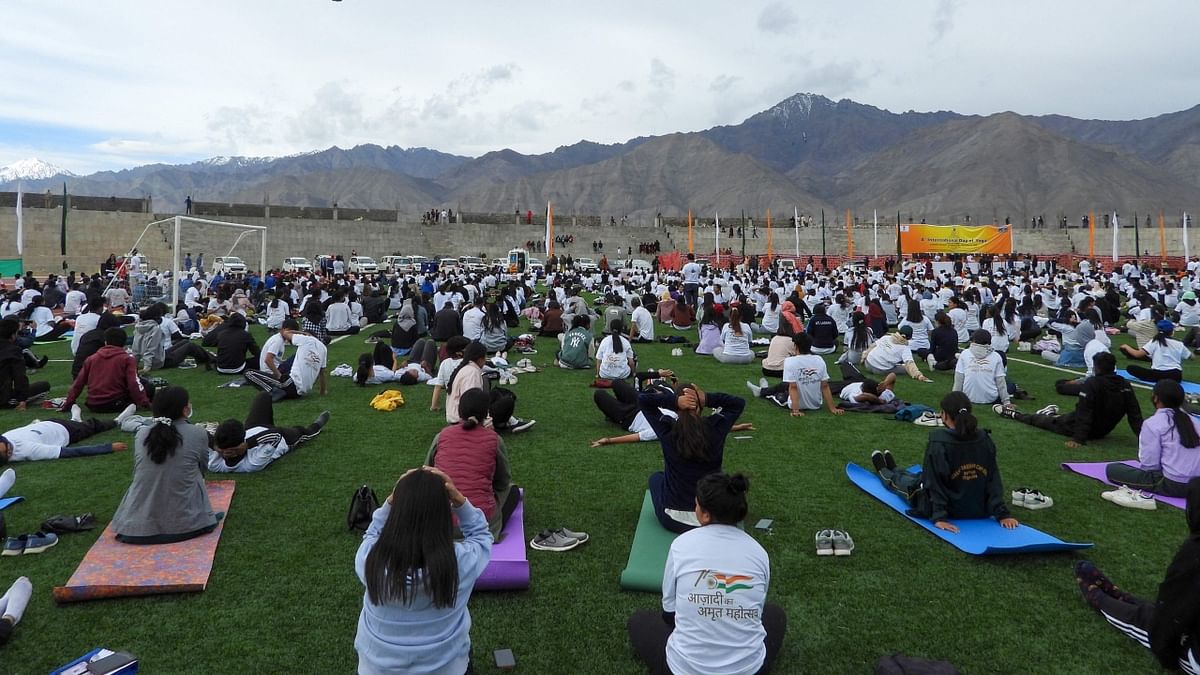 Fitness enthusiasts participate in a mass yoga session to celebrate the International Day of Yoga in Leh. Credit: AFP Photo