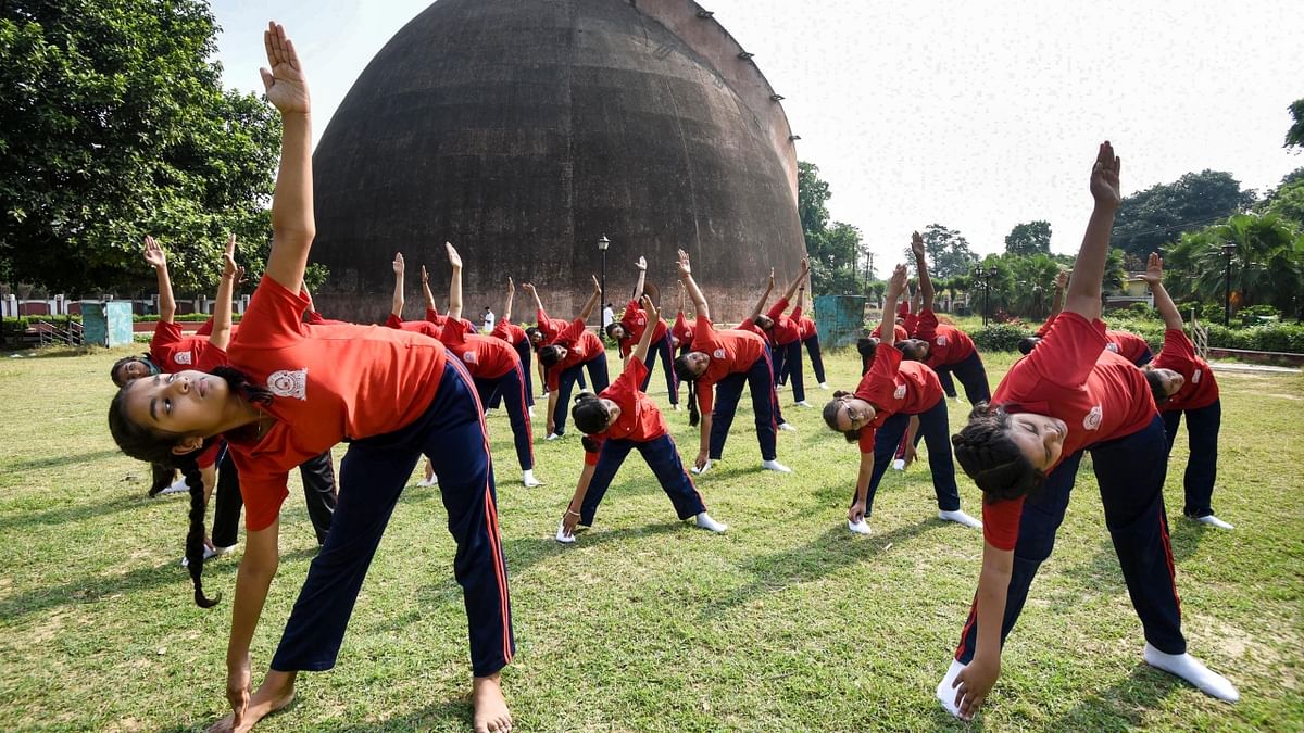 School students perform yoga outside historic Gol Ghar on the occasion of the 8th International Yoga Day, in Patna. Credit: PTI Photo
