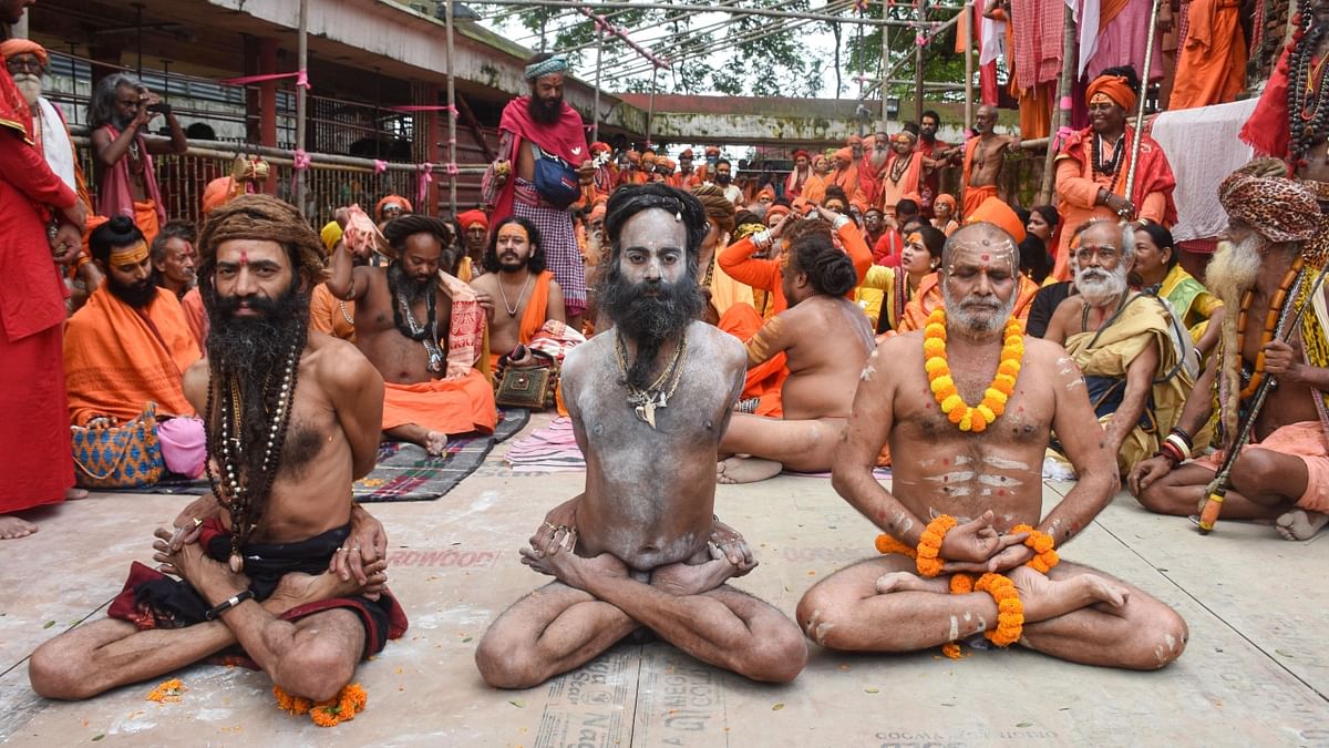 Sadhus perform yoga at the Kamakhya temple on the 8th International Day of Yoga Day, in Guwahati. Credit: PTI Photo