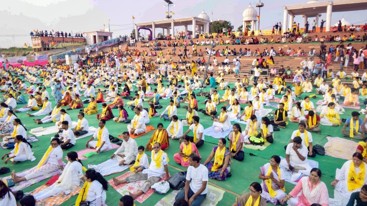 People perform yoga at a mass yoga event, on the occasion of the 8th International Yoga Day, in Patna. Credit: PTI Photo