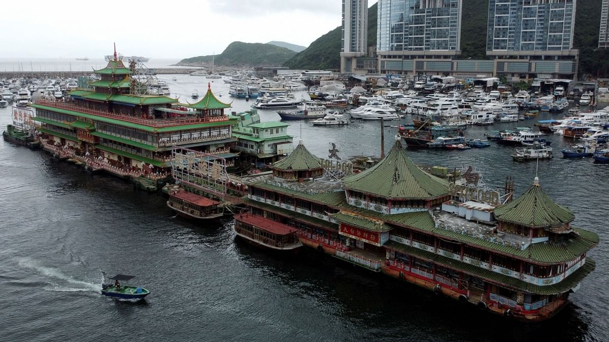 The buoyant behemoth, which at 76 metres (250 feet) long could house 2,300 diners, set out shortly before noon from the southern Hong Kong Island typhoon shelter where it has sat for nearly half a century. Credit: AFP Photo