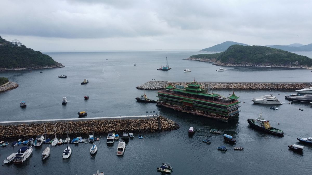 Tugboats towed the restaurant away but it wasn't clear where it will berth next. Credit: AFP Photo
