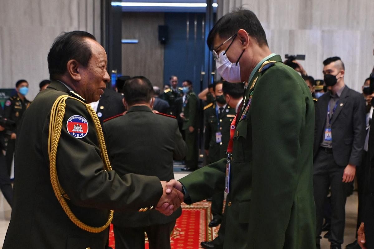 Cambodia's Deputy Prime Minister and Defence Minister Tea Banh (L) shakes hands with Myanmar’s Defence Minister Mya Tun Oo (R) during the Association of Southeast Asian Nations (ASEAN) Defence Ministers Meeting (ADMM) in Phnom Penh. Credit: AFP Photo