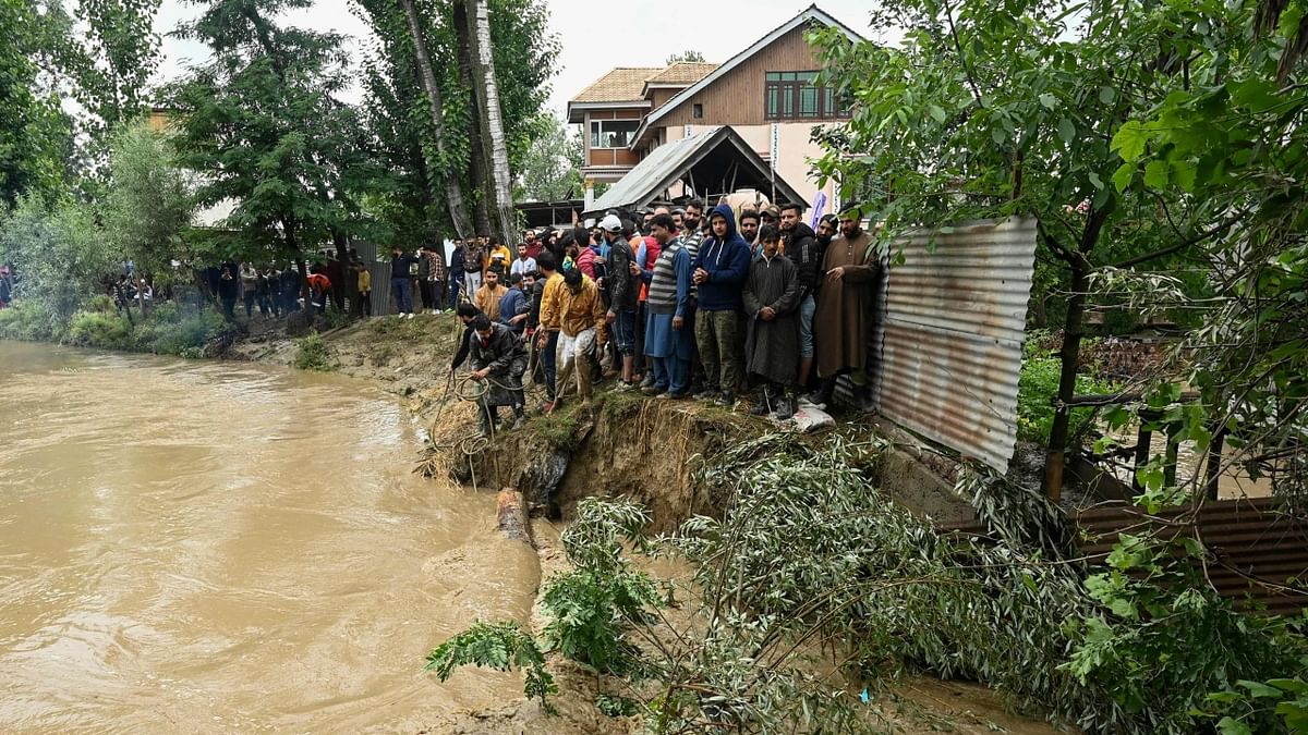 Heavy rains lashed Jammu and Kashmir, triggering flash floods and landslides, with authorities forced to shut schools in several districts and evacuate people from low-lying areas. Credit: AFP Photo