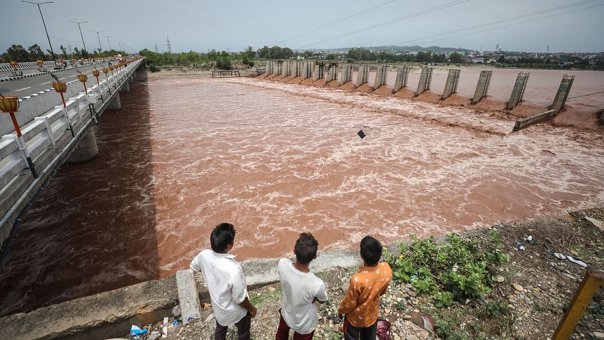The water level in all the major and minor rivers and tributaries in Jammu and Kashmir rose sharply due to incessant rainfall during the last 48 hours as authorities closed schools in six districts to avoid any mishap. Credit: PTI Photo