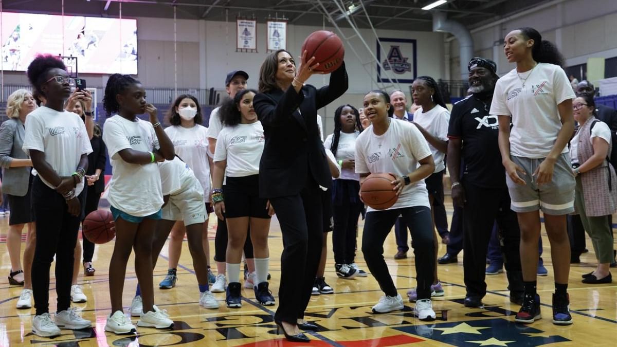 US Vice President Kamala Harris plays basketball with schoolgirls during a Title IX 50th Anniversary Field Day event at American University on June 22, 2022 in Washington, DC. Credit: AFP Photo