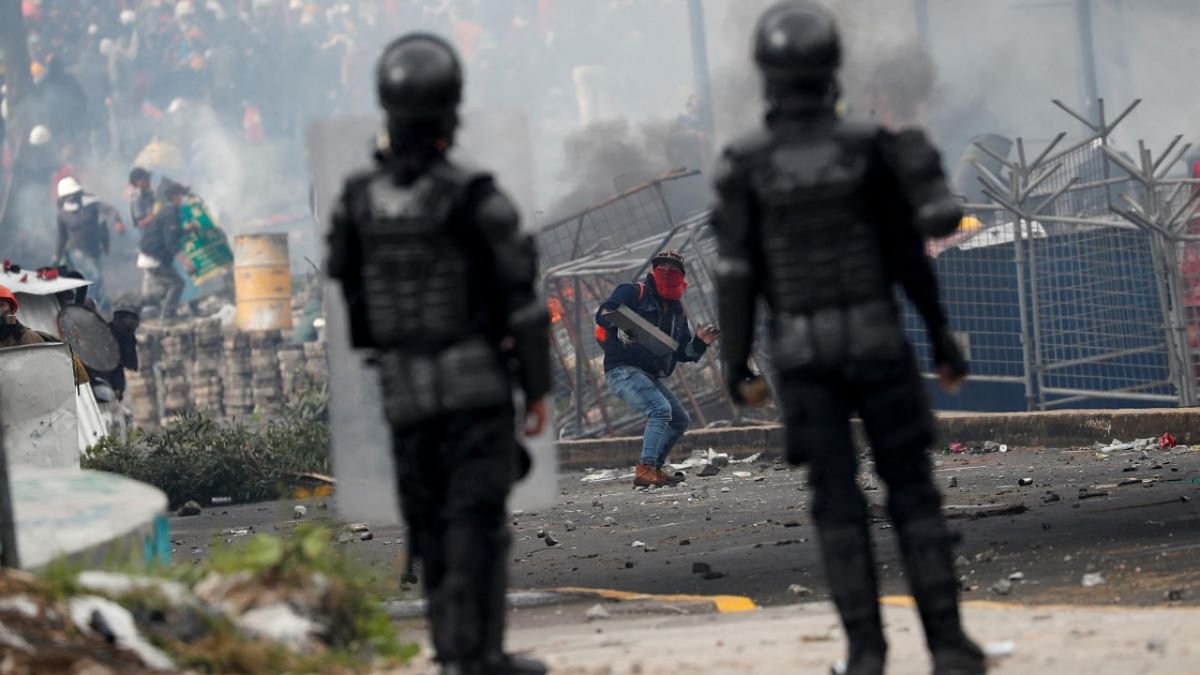 Riot police officers look on during an anti-government protest amid a stalemate between the government of President Guillermo Lasso and largely indigenous demonstrators who demand an end to emergency measures, in Quito. Credit: Reuters photo