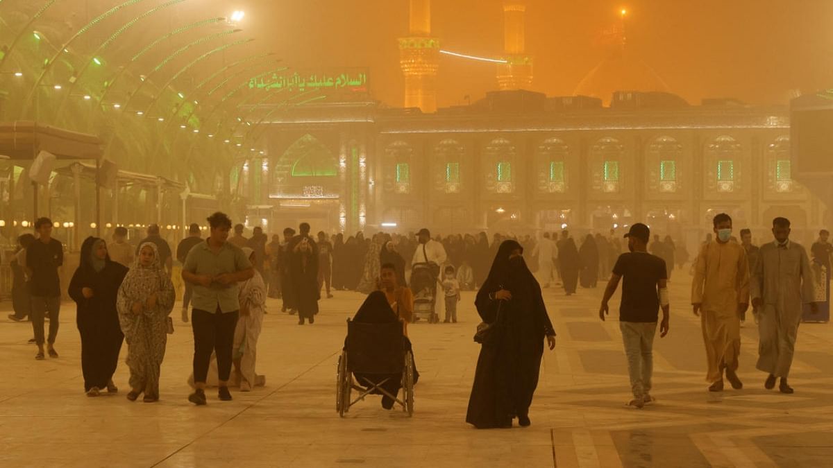 People are pictured near Imam Hussein shrine during a sandstorm in the holy city of Kerbala, Iraq. Credit: Reuters photo