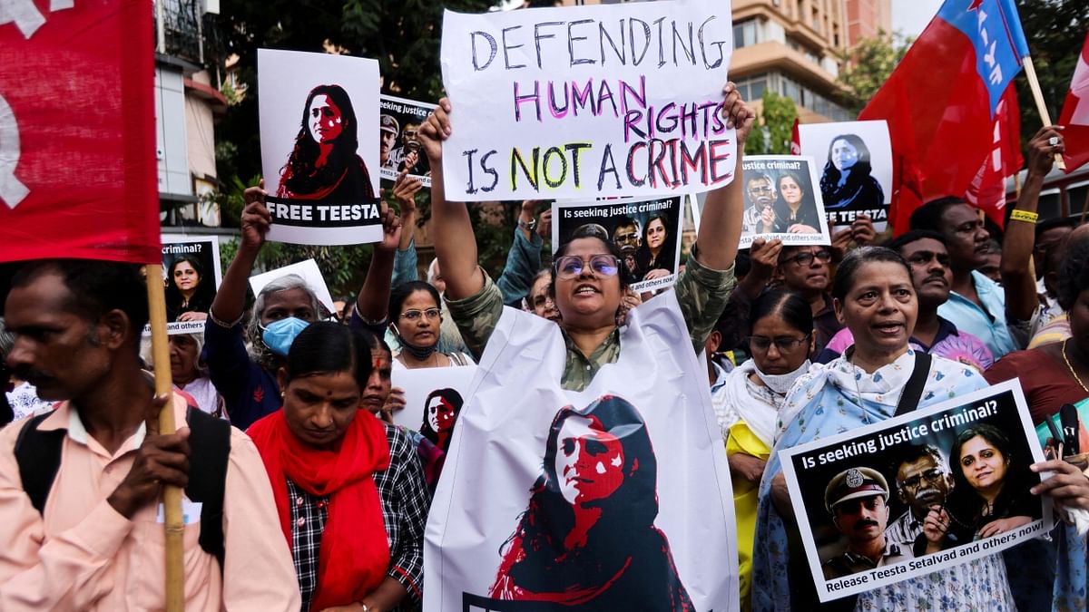 Protestors demand the release of activist Teesta Setalvad after she was arrested from her home by the anti-terrorism wing of the Gujarat police, on a street in Mumbai. Credit: AFP Photo