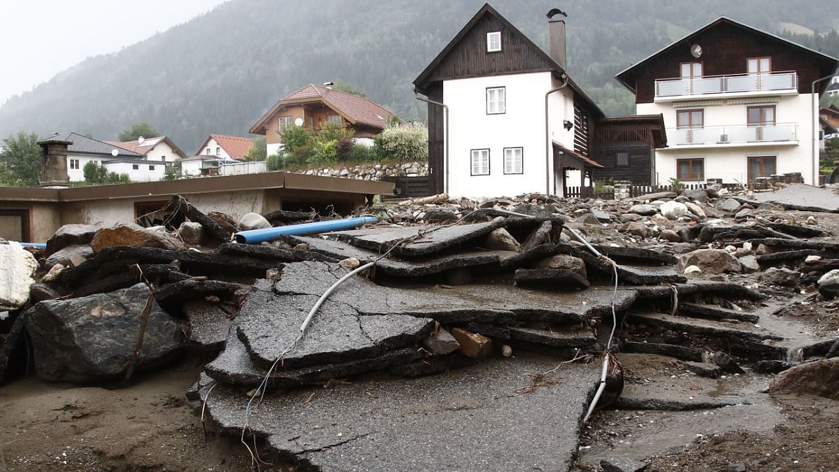Debris and chunks of asphalt are pictured after heavy rain in Treffen, in the Villach-Land district of the Carinthia state, Austria. Credit: AFP Photo