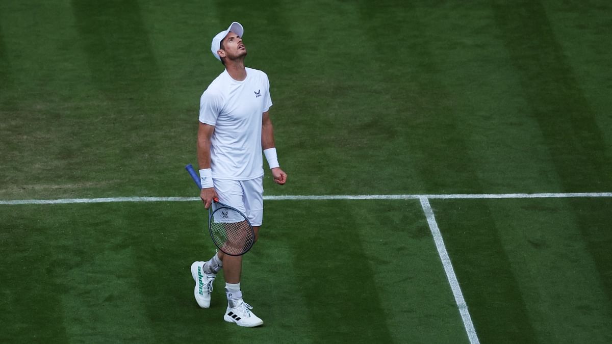 Britain's Andy Murray looks dejected after losing a point during his second-round match against John Isner at the All England Lawn Tennis and Croquet Club in London, Britain. Credit: Reuters Photo