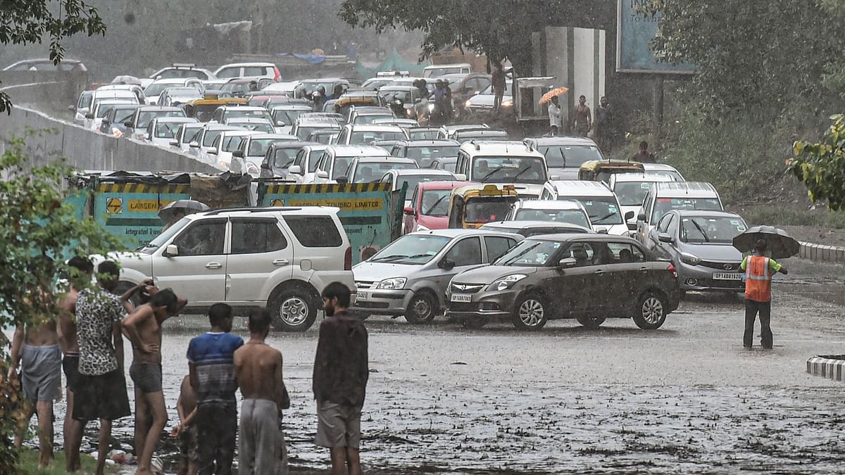 Vehicles stuck in a heavy traffic jam on a road amid monsoon rains, in New Delhi. Credit: PTI Photo