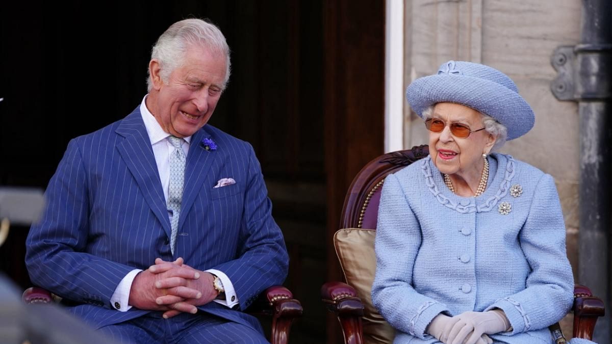 Britain's Prince Charles, Prince of Wales, known as the Duke of Rothesay when in Scotland and Britain's Queen Elizabeth II attend the Queen's Body Guard for Scotland (also known as the Royal Company of Archers) Reddendo Parade in the gardens of the Palace of Holyroodhouse in Edinburgh on June 30, 2022. Credit: AFP Photo