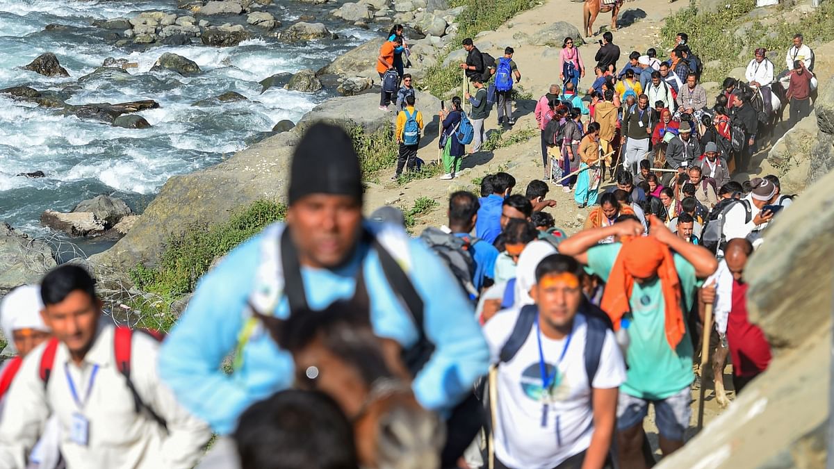 Pilgrims left in a secured convoy to perform pilgrimage to the cave shrine of Amarnath in the south Himalayas amid tight security arrangements. Credit: PTI Photo