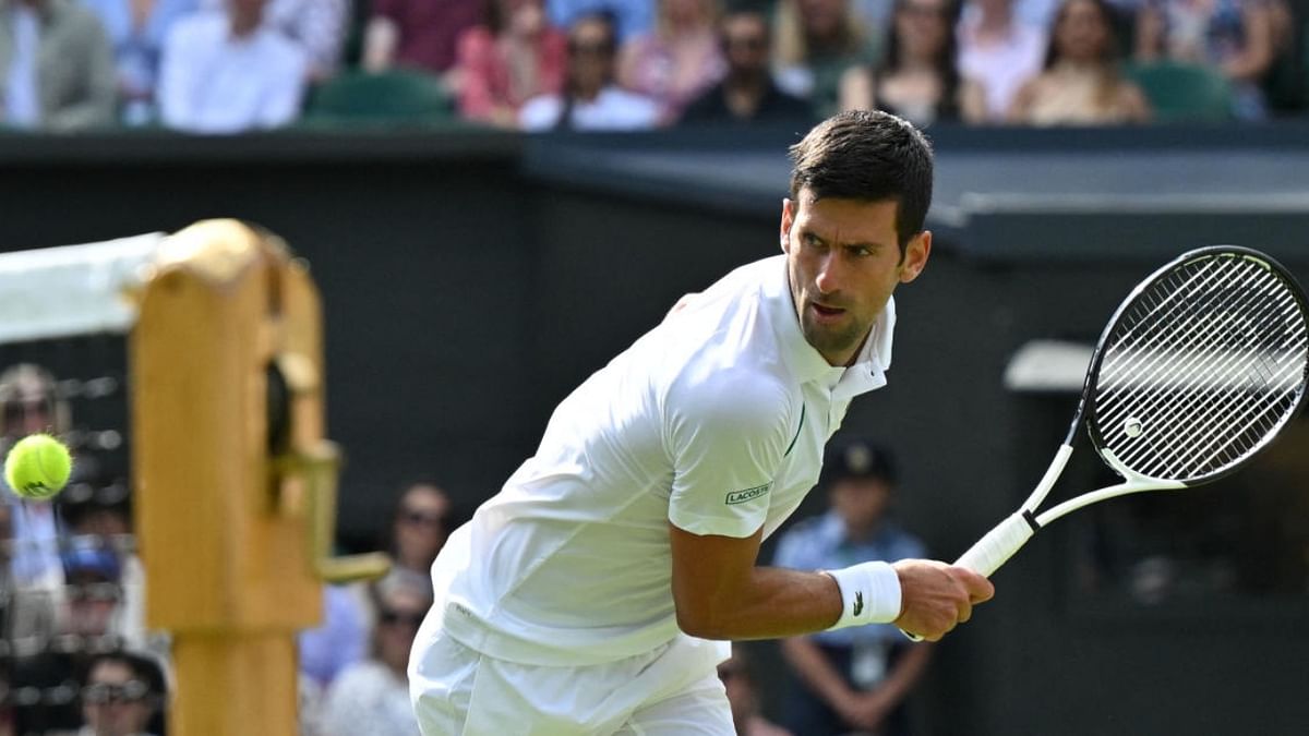 Serbia's Novak Djokovic returns the ball to Serbia's Miomir Kecmanovic during their men's singles tennis match on the fifth day of the 2022 Wimbledon Championships at The All England Tennis Club in Wimbledon, southwest London, on July 1, 2022. Credit: AFP Photo