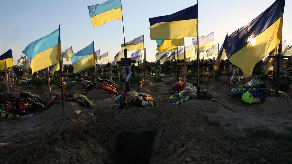 A fresh hole is seen ahead of a funeral, among dozens of recent graves of people who have died since the beginning of Russia's invasion, in the Walk of Heroes section of the cemetery, where people who served as military members, fire fighters and police officers are buried, as Russia's attack continues, in Kharkiv, Ukraine, July 2, 2022. Credit: Reuters Photo