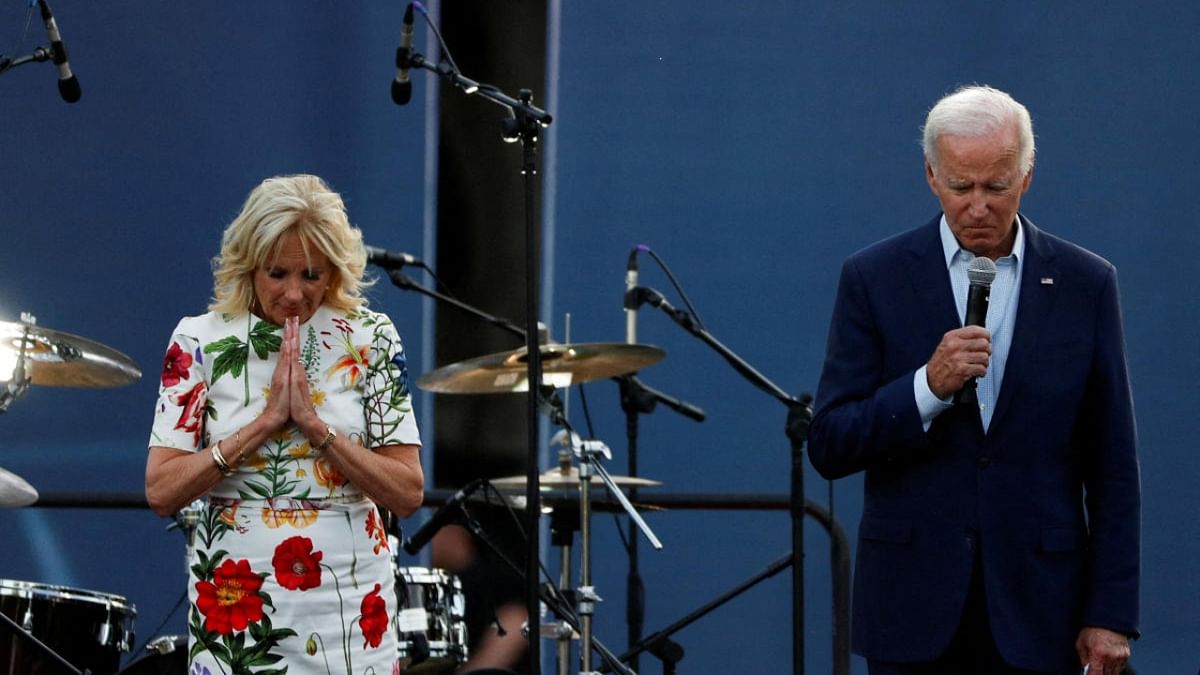 US President Joe Biden and first lady Jill Biden hold a moment of silence for the victims of the mass shooting that took place at a Fourth of July parade route in Chicago suburb of Highland Park, Illinois, during an Independence Day celebration on the South Lawn of the White House in Washington, US, July 4, 2022.. Credit: Reuters Photo