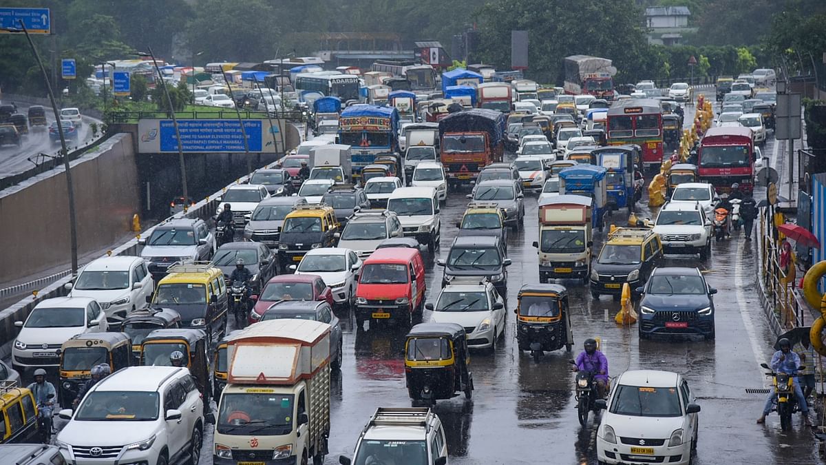 From roads to railway tracks, waterlogging slowed the movement of vehicles and trains. Credit: PTI Photo