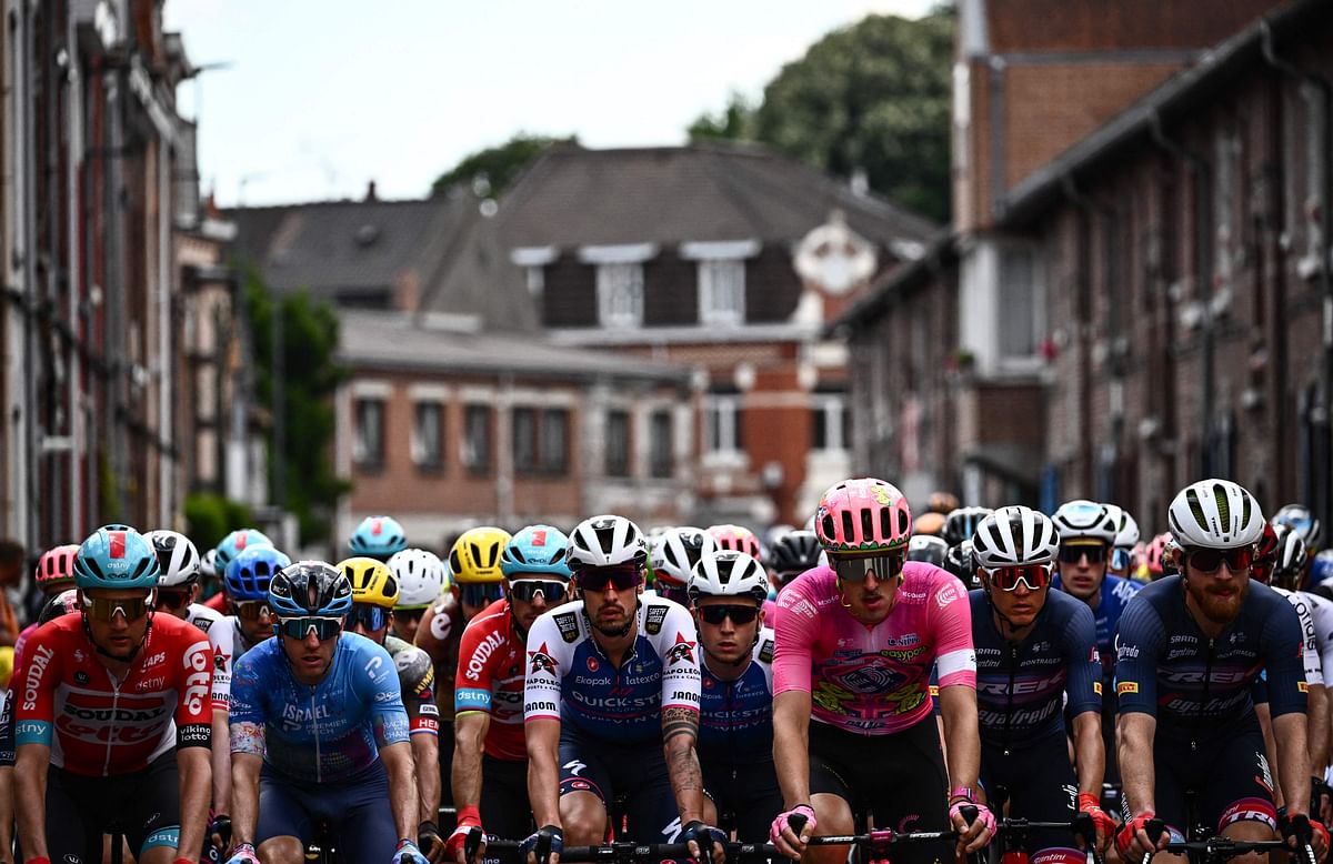 he pack of riders cycles at the start of the 5th stage of the 109th edition of the Tour de France cycling race, 153,7 km between Lille and Arenberg Porte du Hainaut, in northern France. Credit: AFP Photo