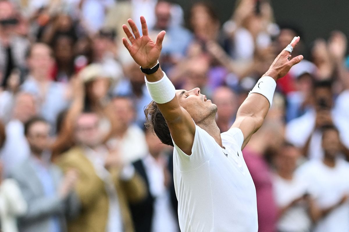 Spain's Rafael Nadal celebrates winning against US player Taylor Fritz during their men's singles quarter final tennis match on the tenth day of the 2022 Wimbledon Championships. Credit: AFP Photo