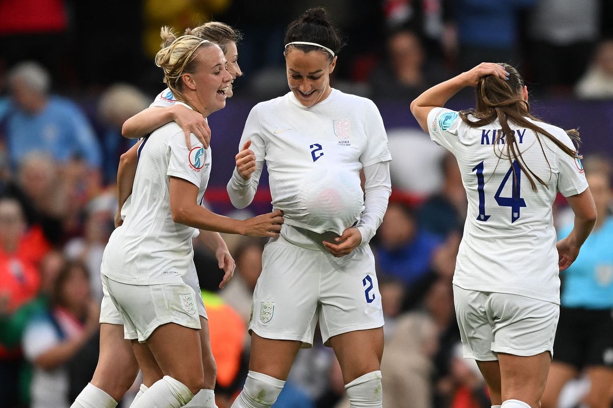 England's defender Lucy Bronze (C) and teammates celebrate their opening goal during the UEFA Women's Euro 2022 Group A football match between England and Austria. Credit: AFP Photo