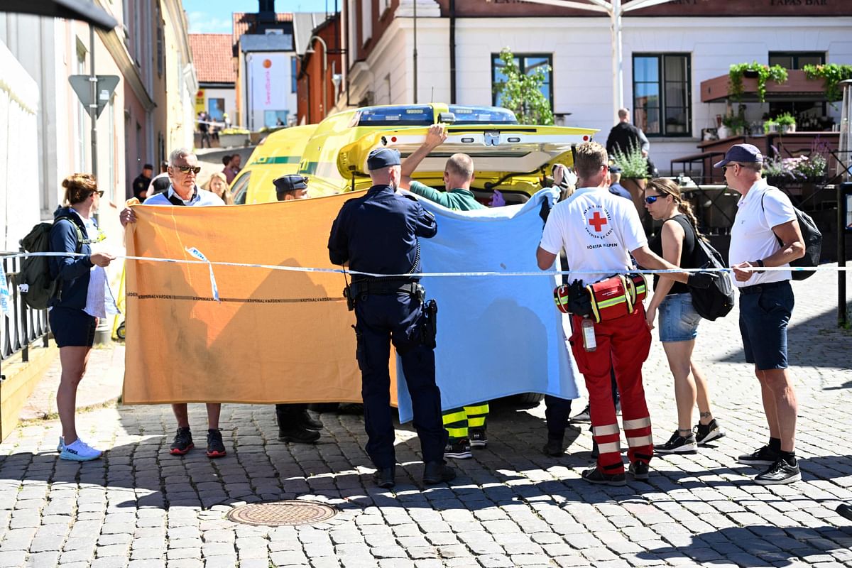 Police and rescue services transfer a woman who has been seriously injured in a stabbing at the Almedalen political festival into an ambulance car, in Visby on the Swedish island of Gotland. Credit: AFP Photo