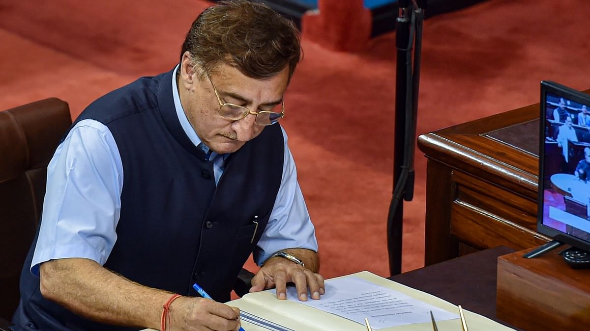 Congress leader Vivek Tankha signs the register after taking oath as a Rajya Sabha member at Parliament House, in New Delhi. Credit: PTI Photo