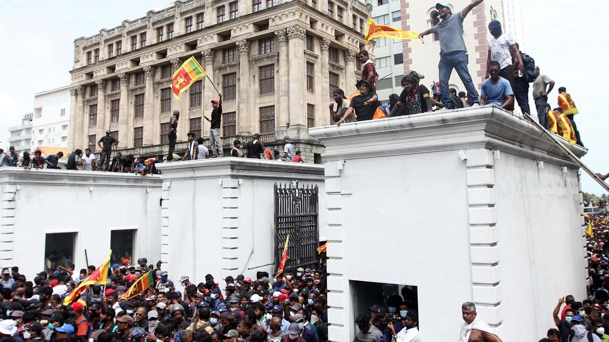 Protesters who climbed the walls of the President’s House are now occupying it without damaging any property or indulging in acts of violence. Credit: AFP Photo