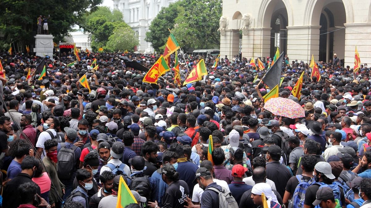 Earlier, the police fired tear gas at two access roads to the President’s House -- Chatham Street and Lotus Road, but the defiant protesters continued unabated. Credit: AFP Photo