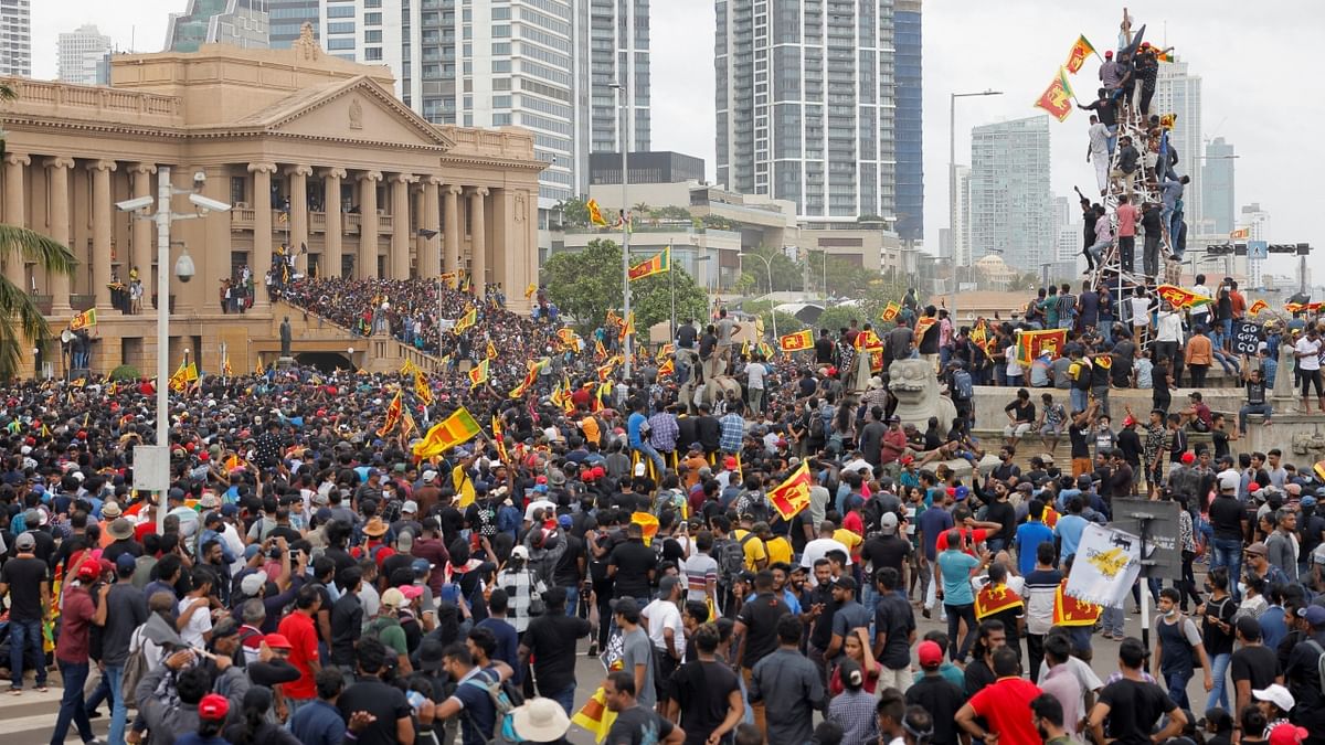 Thousands of irate anti-government protesters in Sri Lanka stormed into embattled President Gotabaya Rajapaksa’s official residence in central Colombo's high-security Fort area after breaking the barricades. Credit: Reuters Photo