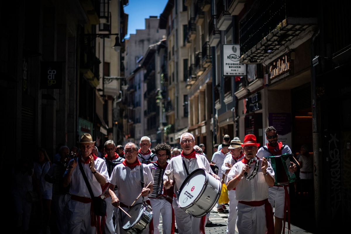 Participants sing and play traditional music in the street during the San Fermin festival in Pamplona, northern Spain. Credit: AFP Photo