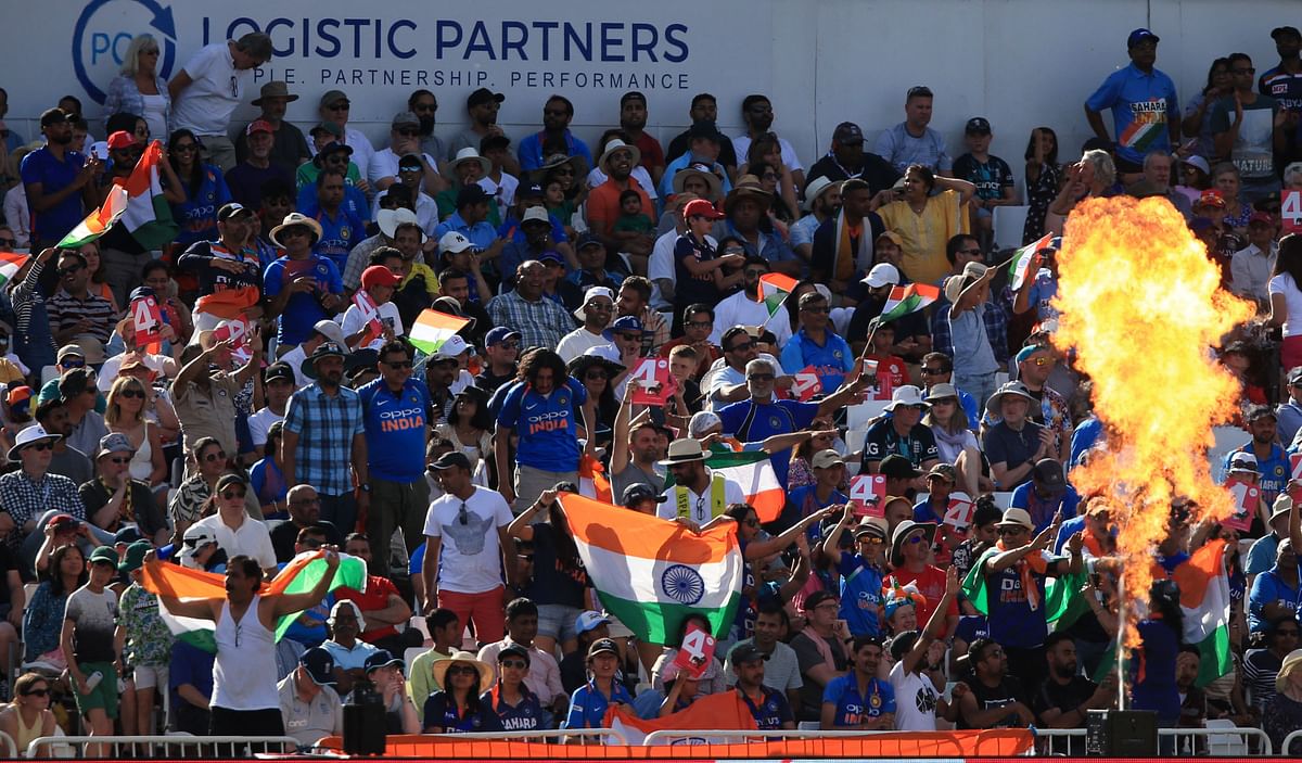 India fans cheer on their team during the '3rd Vitality IT20' Twenty20 International cricket match between England and India at Trent Bridge. Credit: AFP Photo