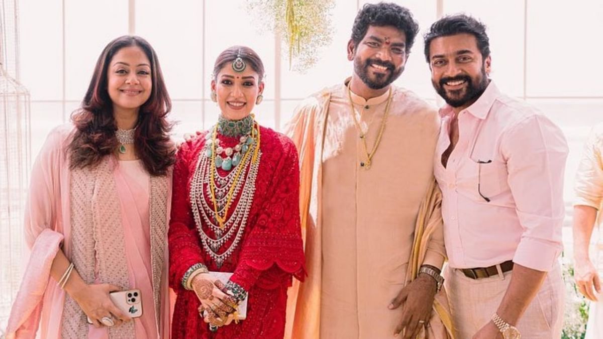 Post the wedding, only a few selected and edited pictures were shared by Vignesh. Celebrating their 1st-month anniversary Vignesh posted several candid pictures of the celebrities from their dreamy. In this photo, Nayan and Vignesh pose with Suriya and Jyothika. Credit: Instagram/wikkiofficial