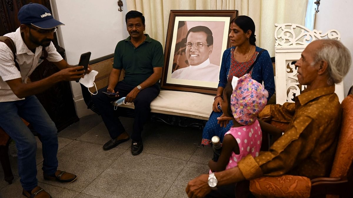 People pose for pictures inside the Sri Lanka's presidential palace, in Colombo. Credit: AFP Photo