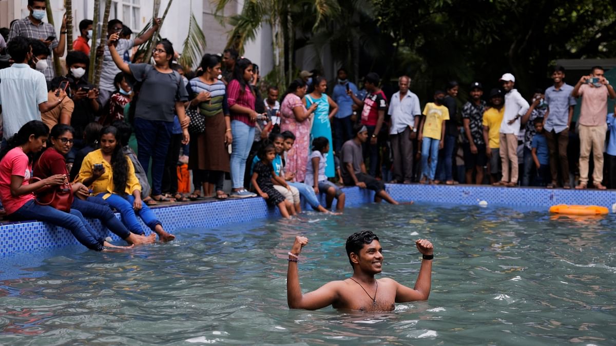 Protestors in Sri Lanka Presidential palace's pool amid the country's economic crisis, in Colombo, Sri Lanka. Credit: Reuters Photo