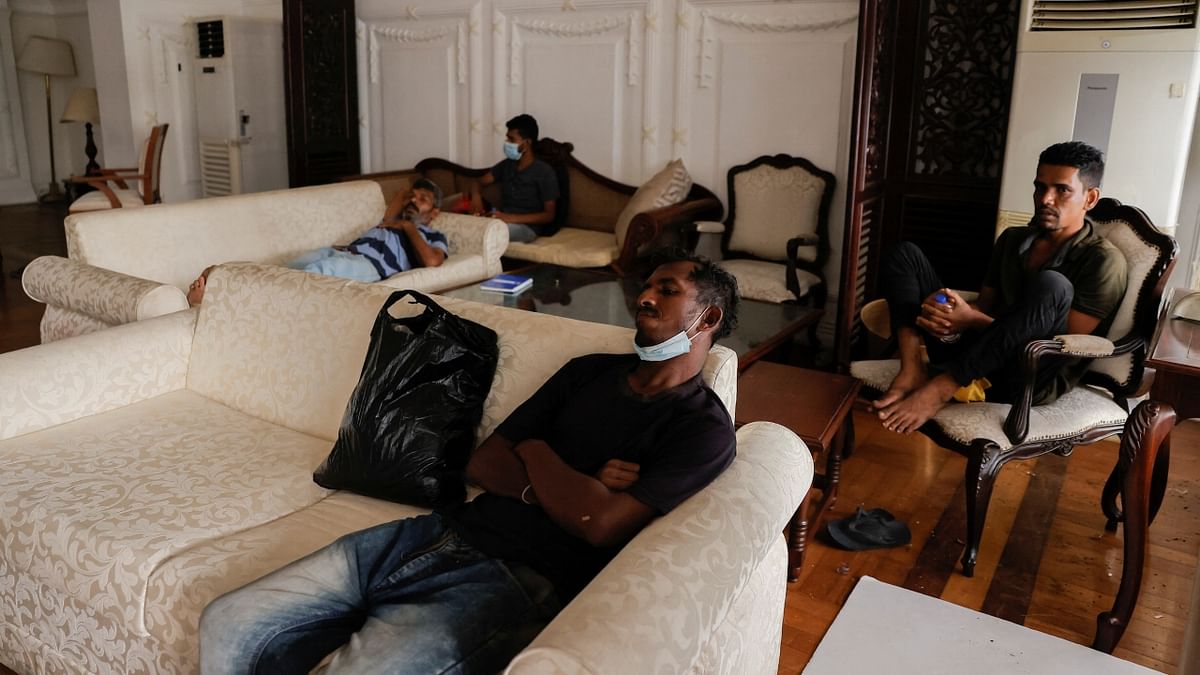 Demonstrators rest inside the Prime Minister's residence on the following day after demonstrators entered into the building, amid the country's economic crisis, in Colombo, Sri Lanka. Credit: Reuters Photo