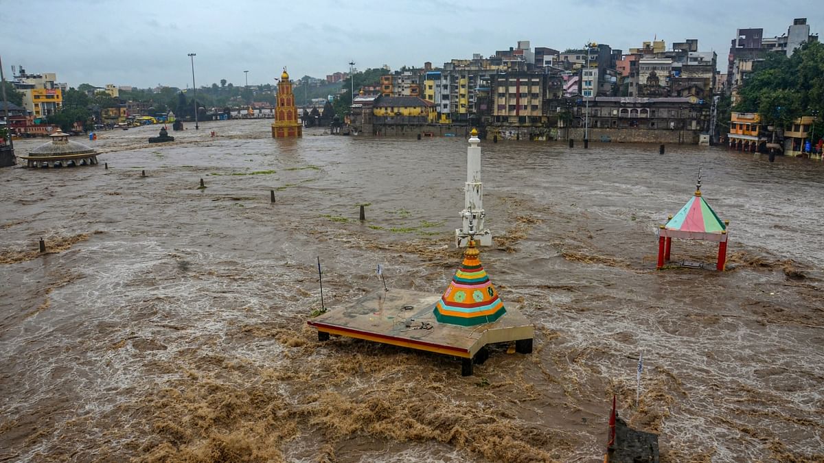 Nashik: Temples submerged in floodwater after a rise in the water level of the Godavari river following the release of water from the Gangapur Dam, which supplies drinking water to the city, and monsoon rains. Credit: PTI Photo
