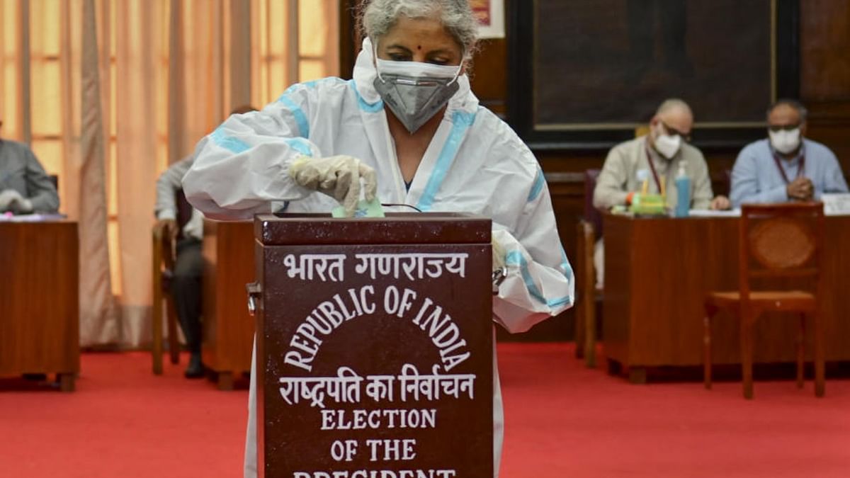 Union Finance Nirmala Sitharaman wearing a PPE kit casts her vote for the election of the President, at Parliament House. Credit: PTI Photo