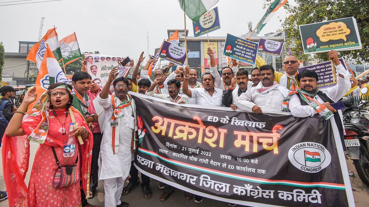 Congress supporters take part in 'Akrosh March' in protest against summoning of party President Sonia Gandhi by the Enforcement Directorate (ED) in the National Herald money laundering case, in Patna. Credit: PTI Photo