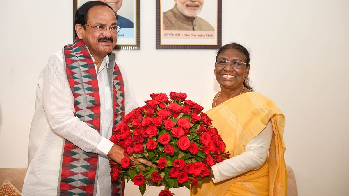 Vice President M Venkaiah Naidu visited Droupadi Murmu's temporary residence and congratulated her on being elected as the 15th President of India. Credit: PTI Photo