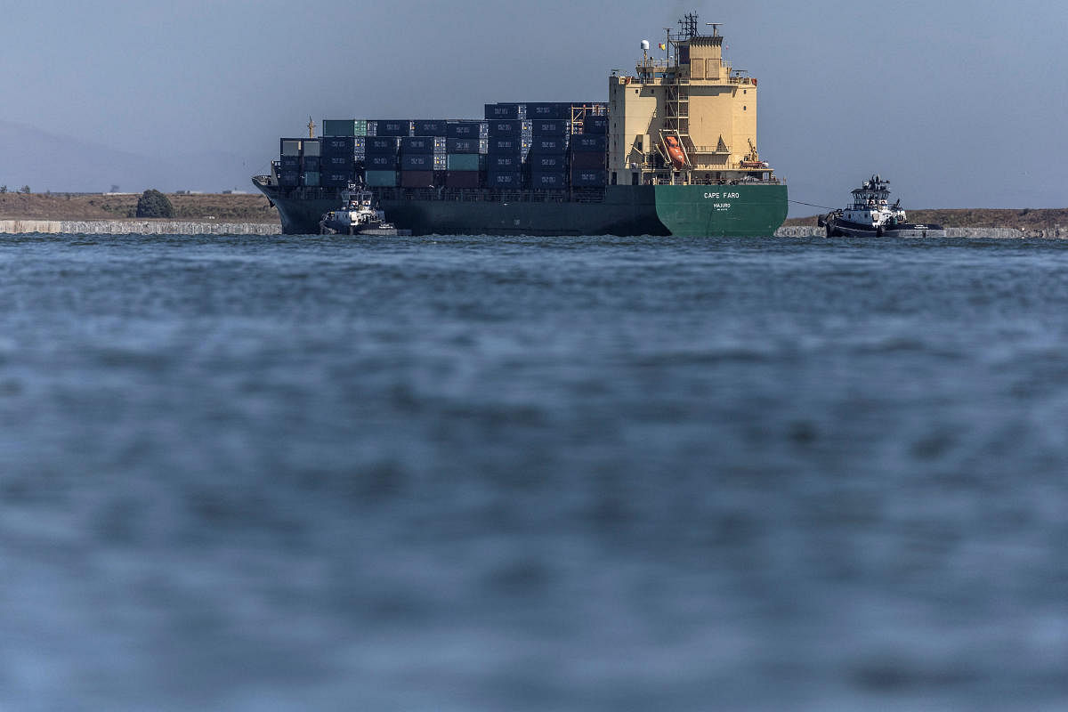 A cargo ship arrives at the port of Oakland as independent truck driver continue protesting against California's new law known as AB5, in Oakland, California, US. Credit: Reuters Photo