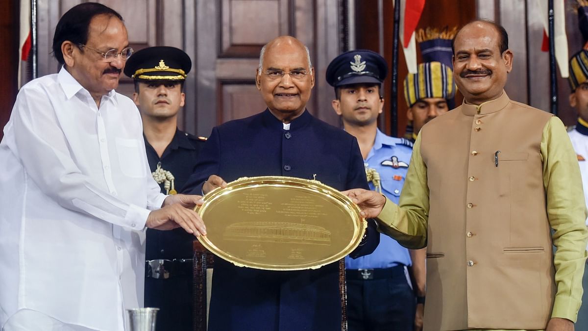 President Ram Nath Kovind being felicitated by Vice President Venkaiah Naidu and Lok Sabha Speaker Om Birla during the farewell function at Parliament House in New Delhi. Credit: PTI Photo